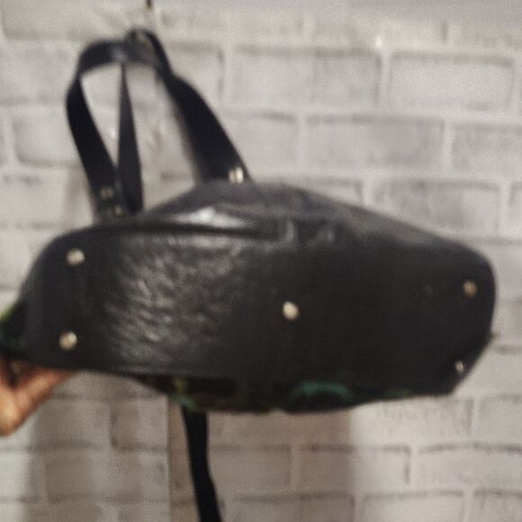 Brown and Black Shoulder Bag with Durable Fabric and Decorative Tassels - Picture 4 of 6